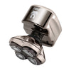 The image shows the Pitbull Platinum PRO PX5 Head and Face Shaver, featuring a shiny metallic finish with multiple flexible shaving blades visible at the front. The shaver has a ergonomic handle and a circular power button on top.